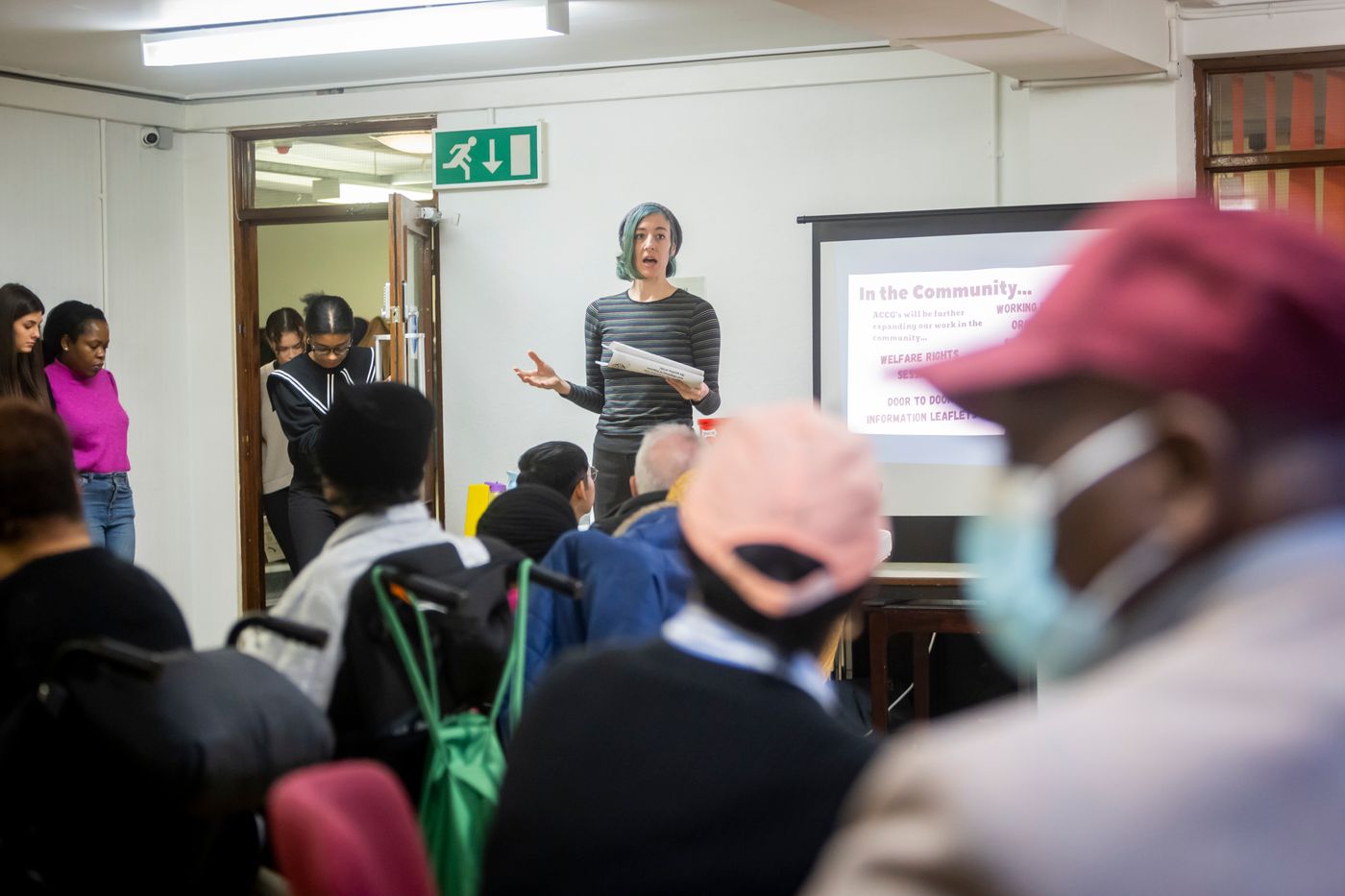 A community group taking part in an educational presentation
